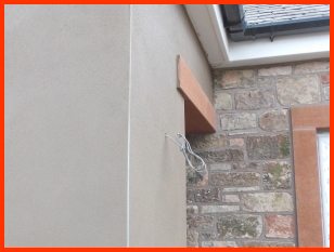 exterior-plastering-services Plastering rendercompleted on an exterior wall with sandstone door head